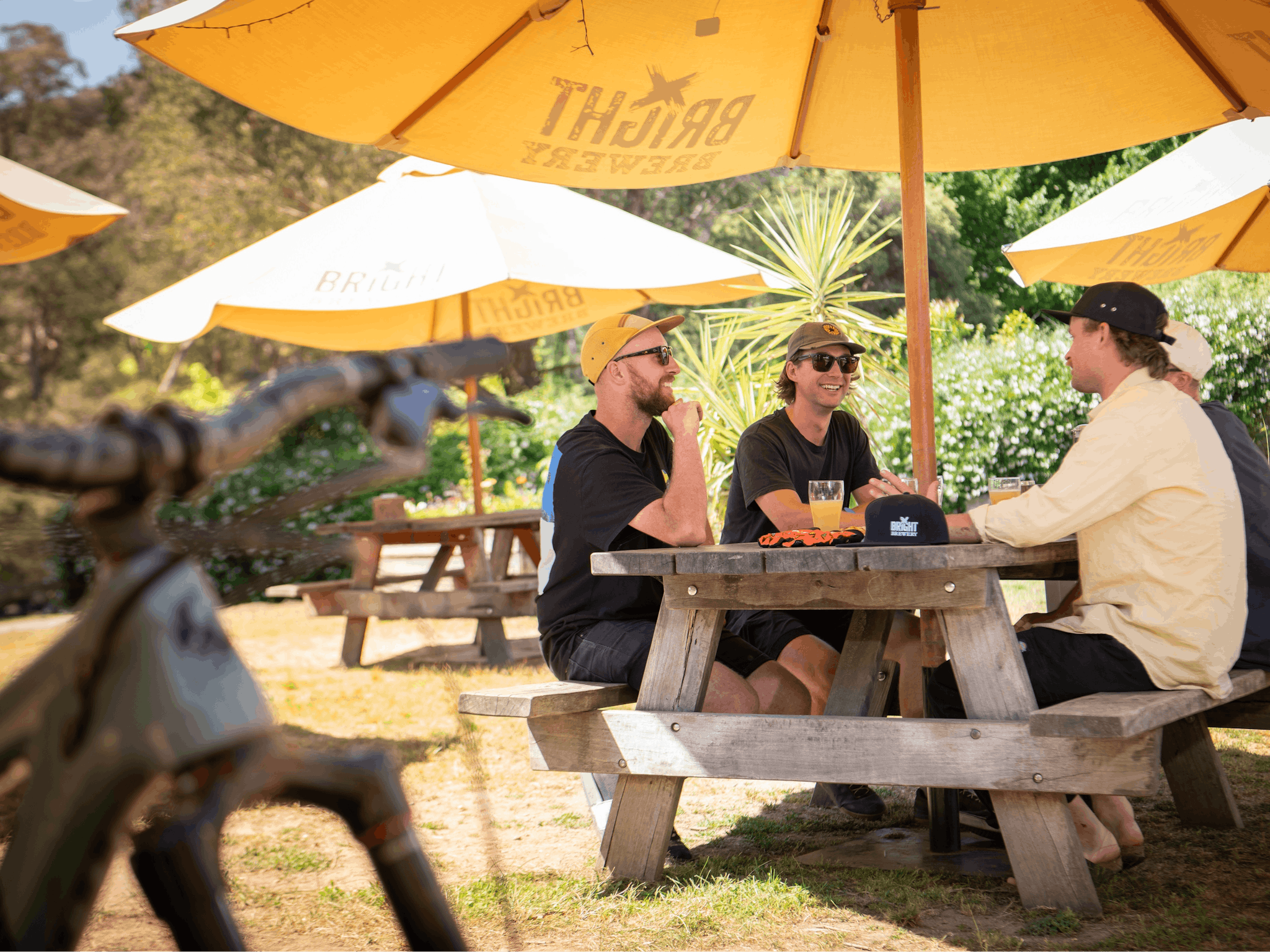 Friends sitting at a table drinking beer