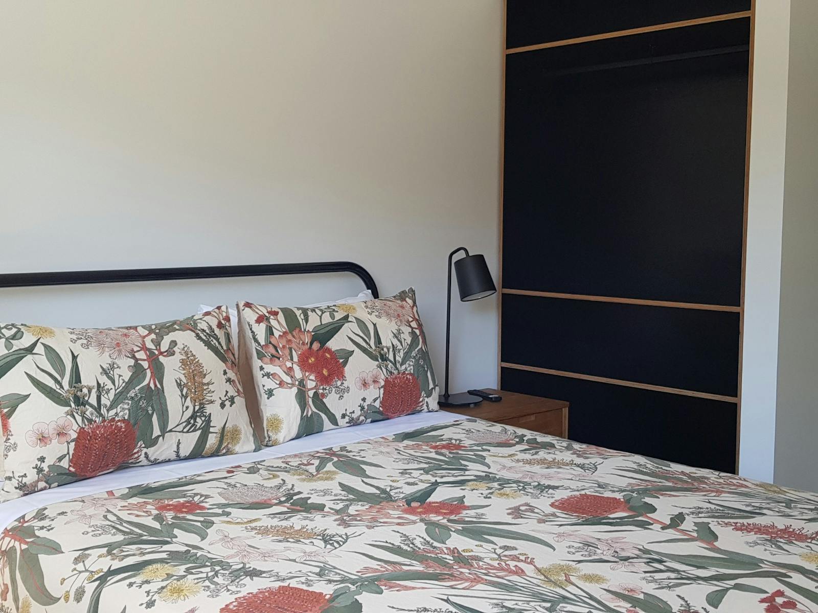 Bedroom with ensuite and two banks of open shelving, for your convenience