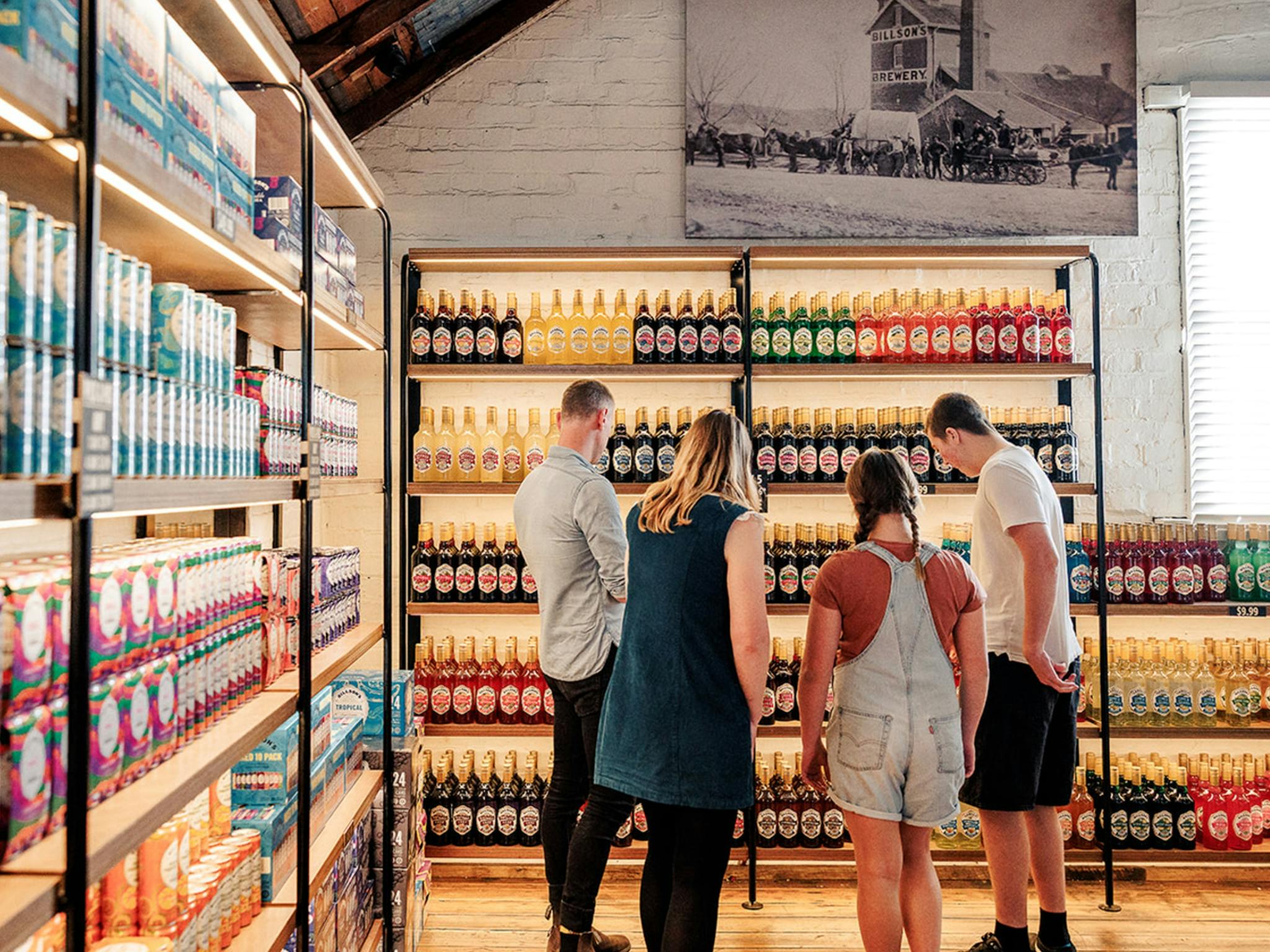 visitors looking at a range of bottles at Last St Brewery
