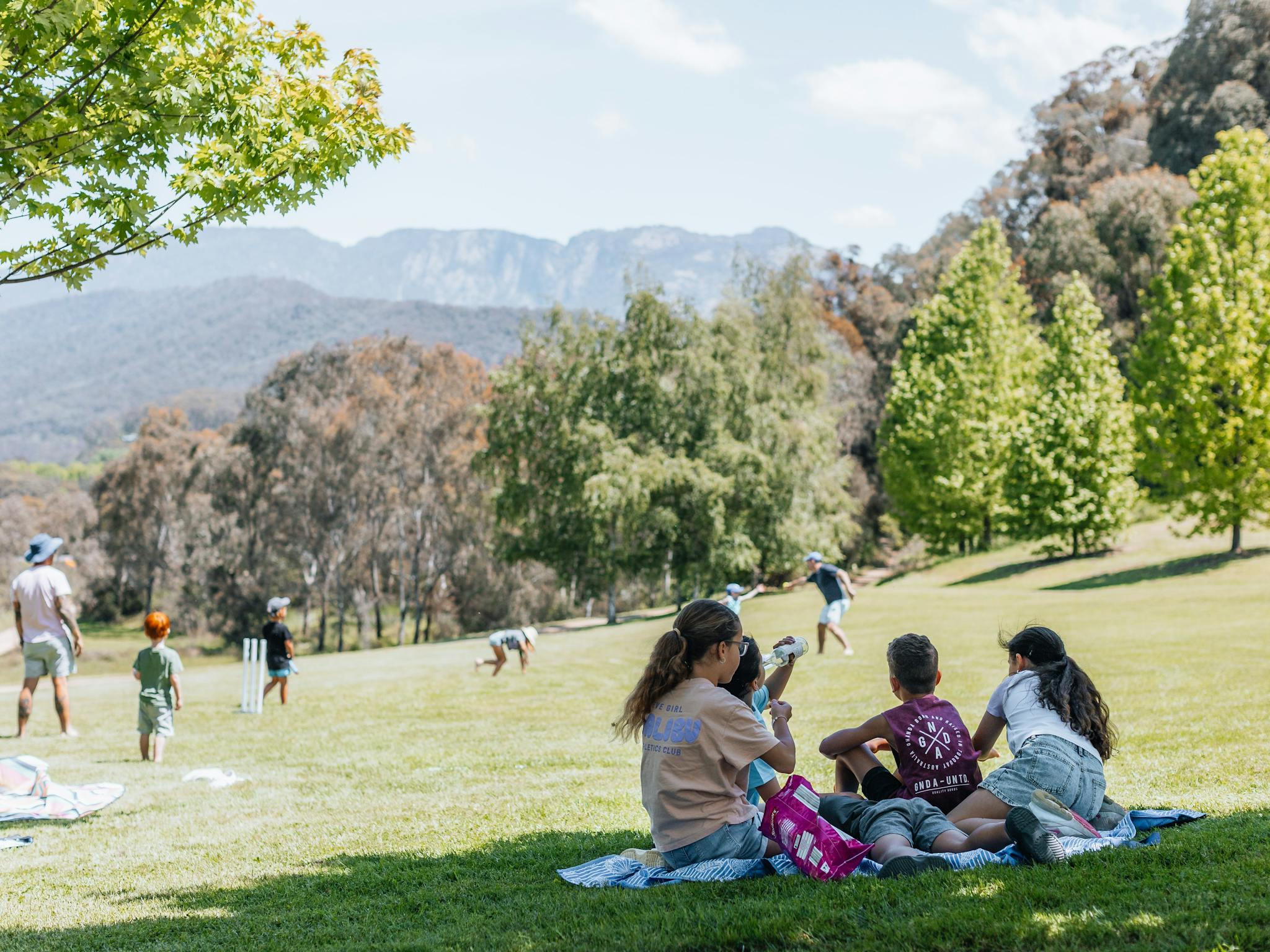 Family enjoying themselves on the lawn at Ringer Reef