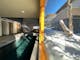 Indoor Lap Pool facing a window looking out onto snow