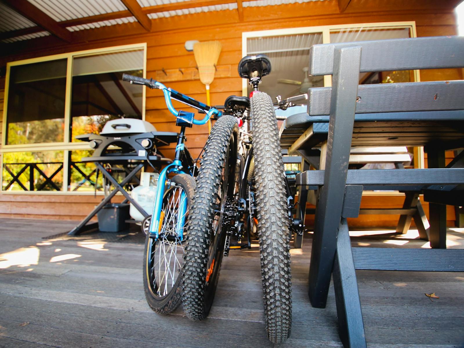 Image of veranda of Cabin with BBQ and guests bikes