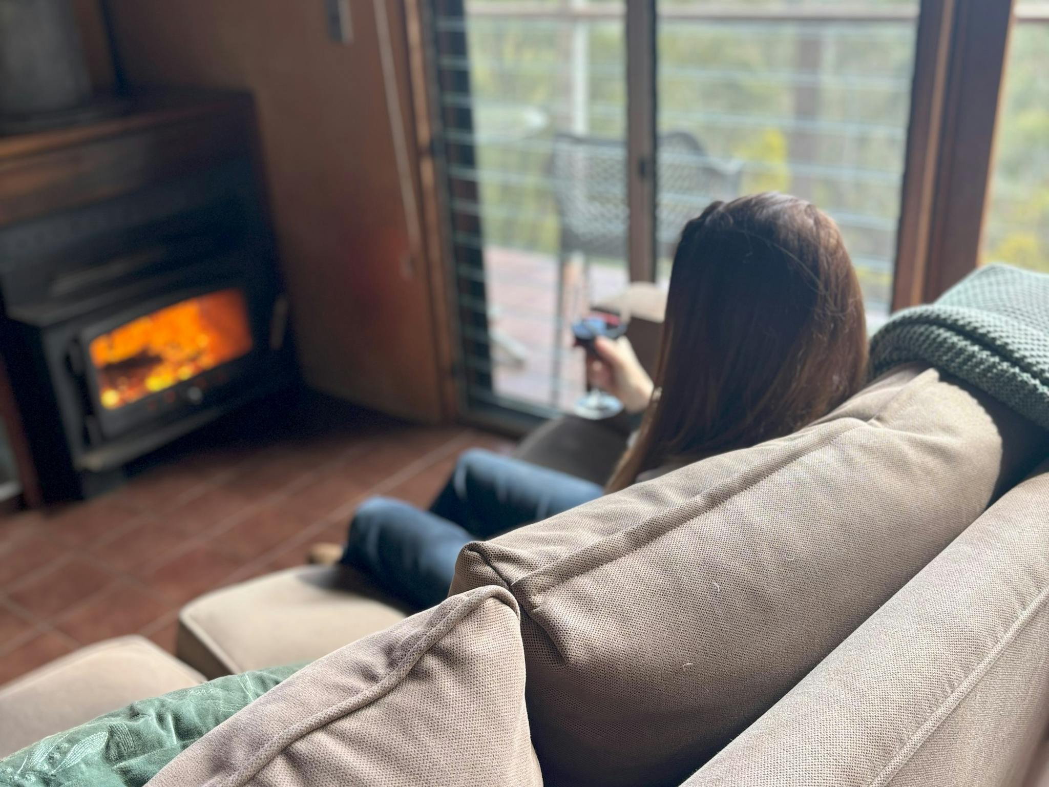 Relaxing by the fire and admiring the views down the Ovens Valley