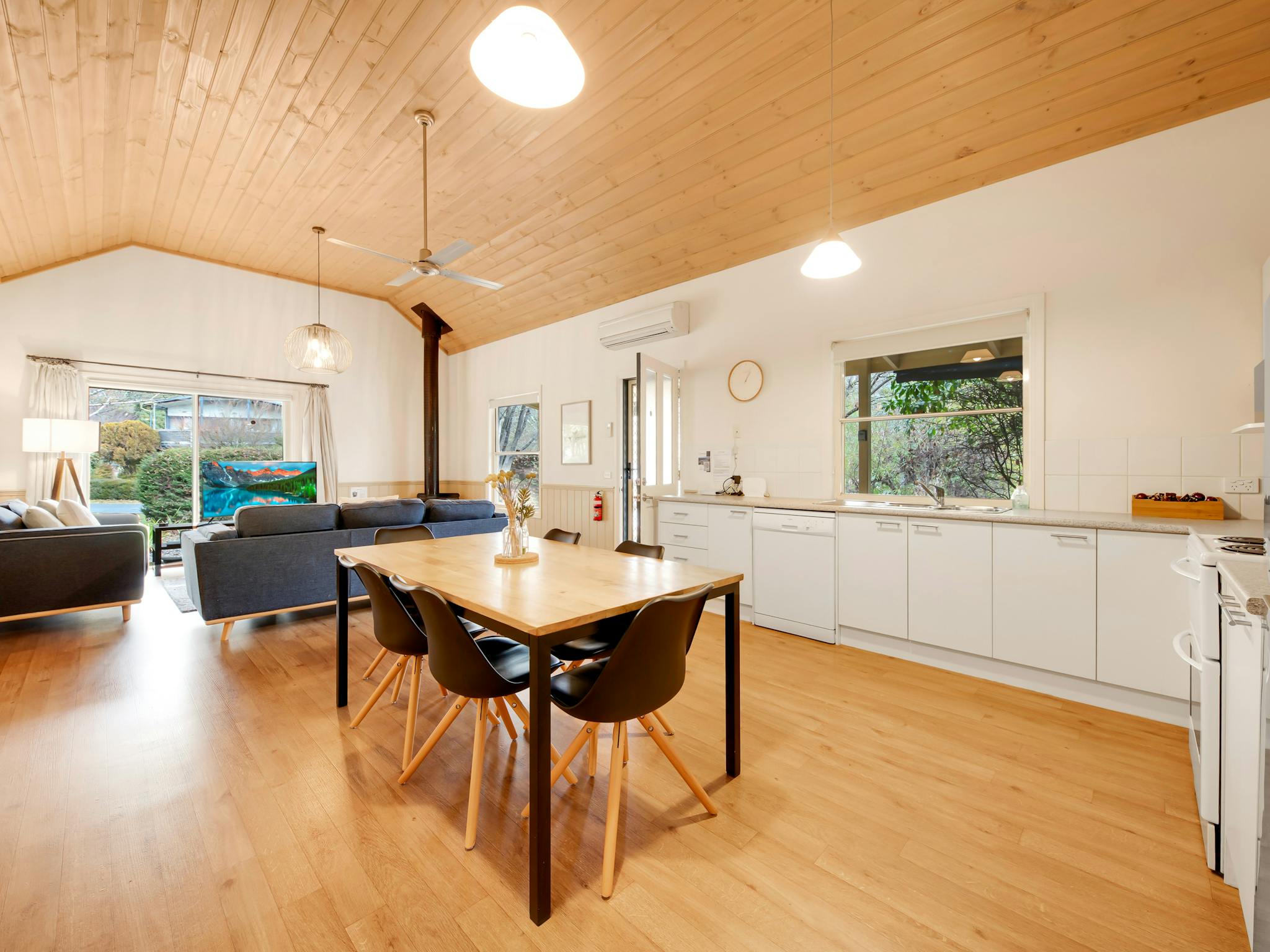 kitchen and dining area with lounge room in the background