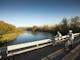 Cyclists crossing the Goulburn River.