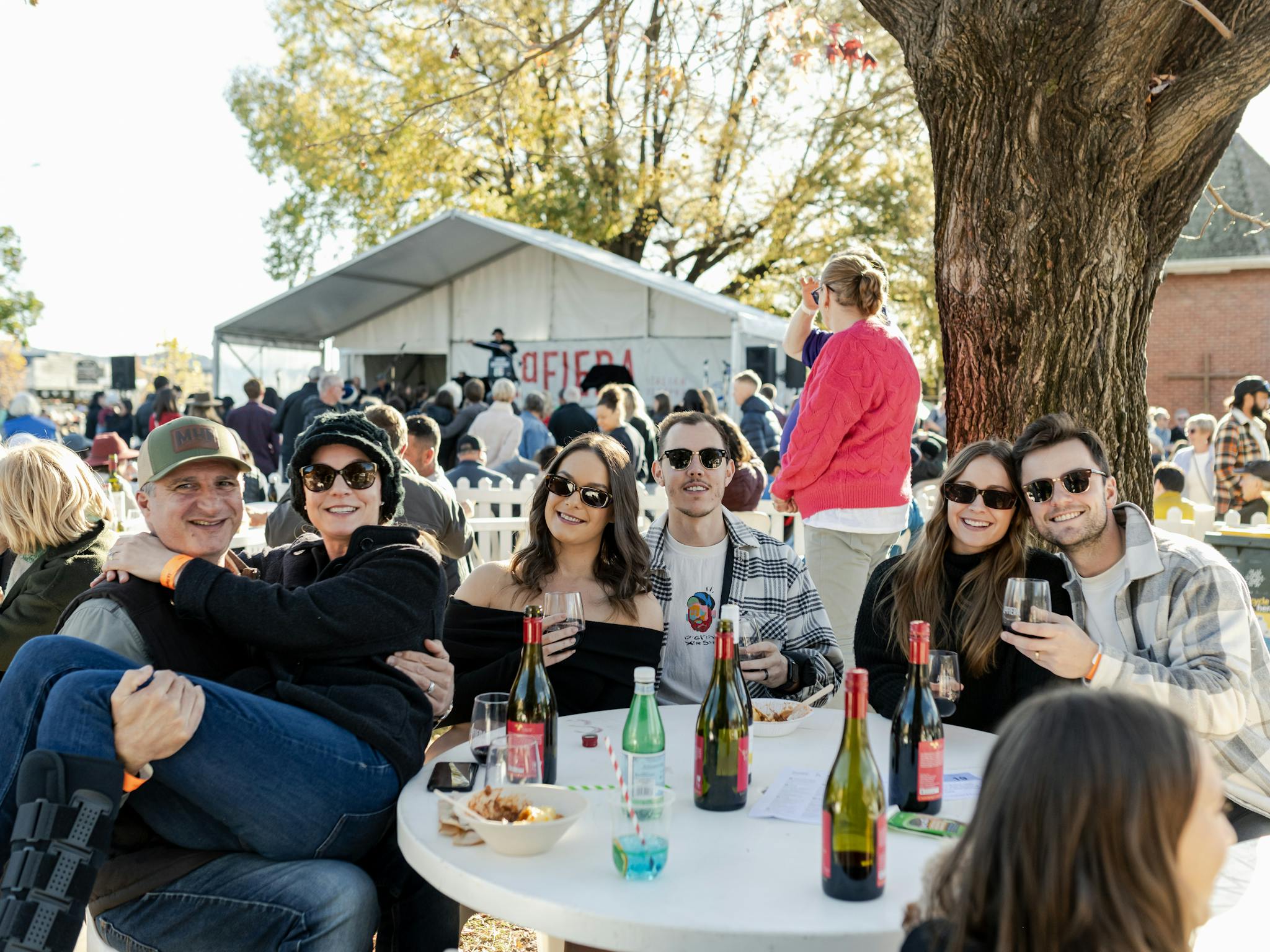 Family and friends sitting together at a table