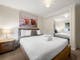 Bedroom with queen bed.
