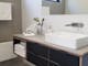 Locally crafted vanity with quality fittings. Plush towels, toiletries provided.