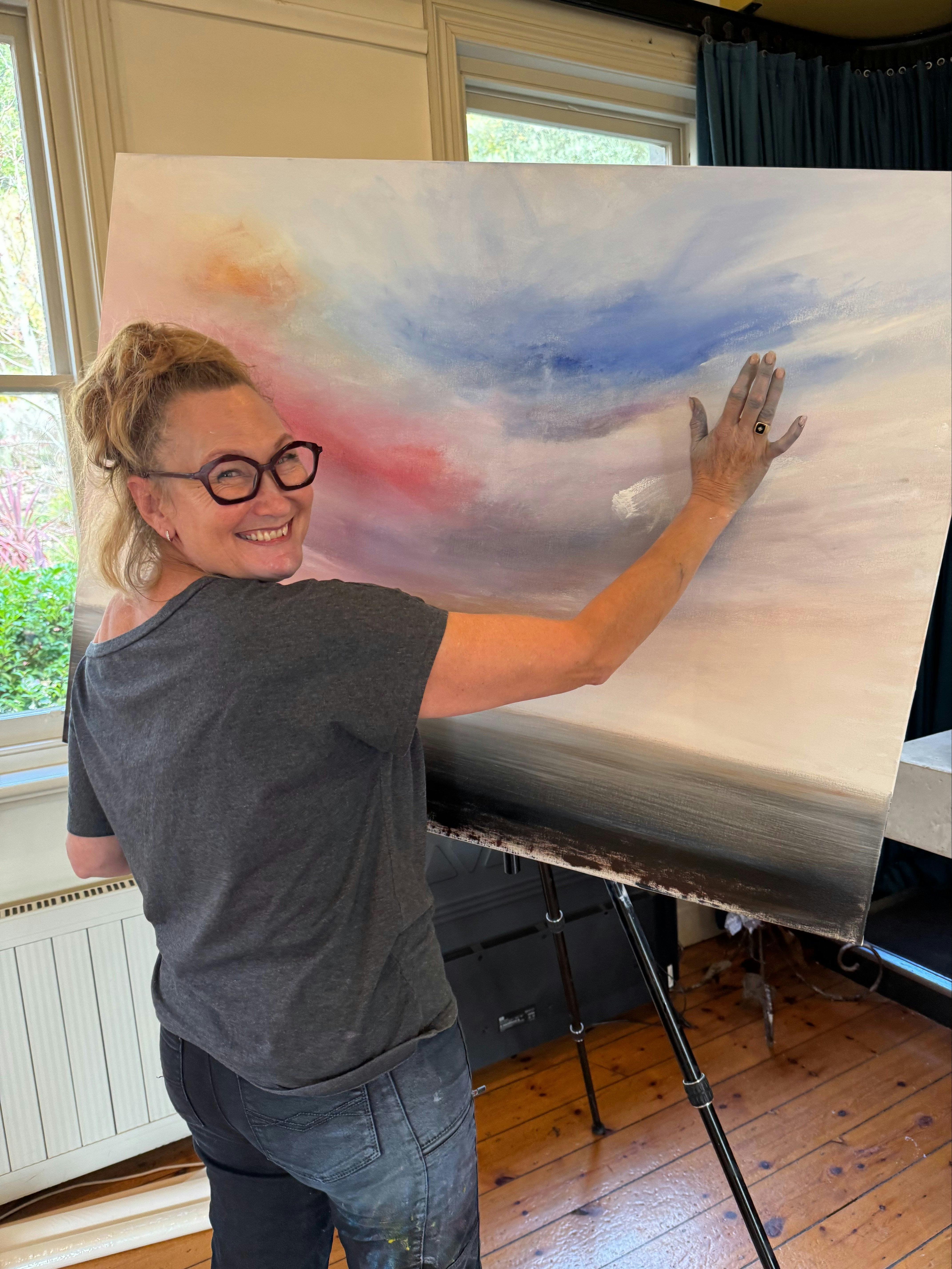 artist painting with hands