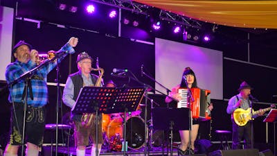 Photo of band of four people, trumpet, saxophone, accordion and bass guitar, Oompah music