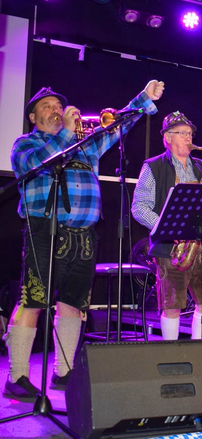 Photo of band of four people, trumpet, saxophone, accordion and bass guitar, Oompah music