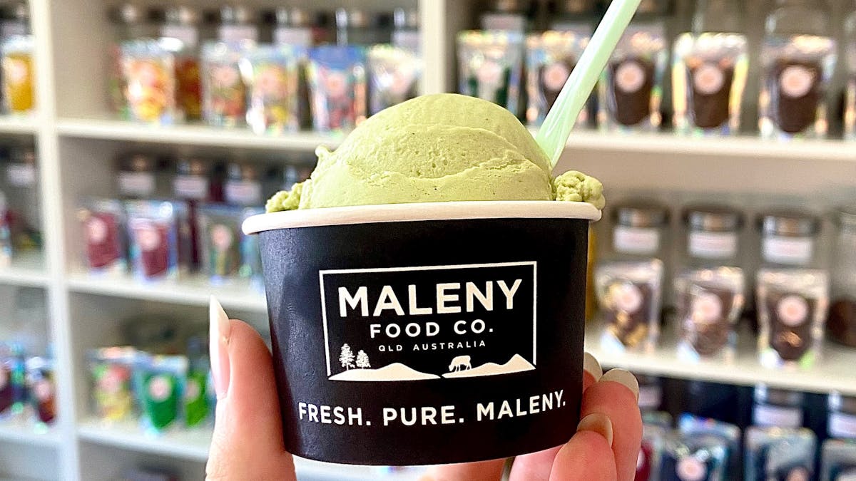 Hand holding a scoop of Maleny Gelato inside Sugar Rush Dayboro confectionery store in Dayboro, Quee