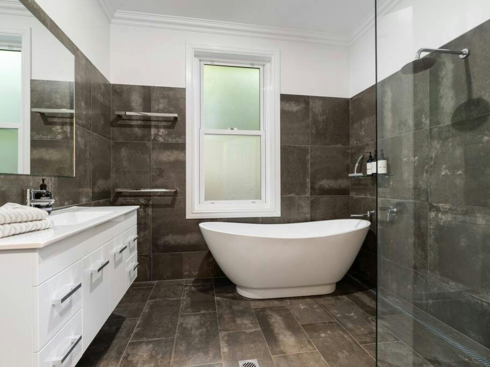 Bathroom with bath and shower