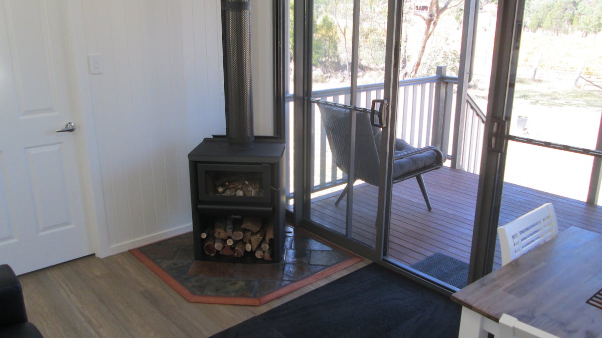 Cabin wood burner with firewood provided
