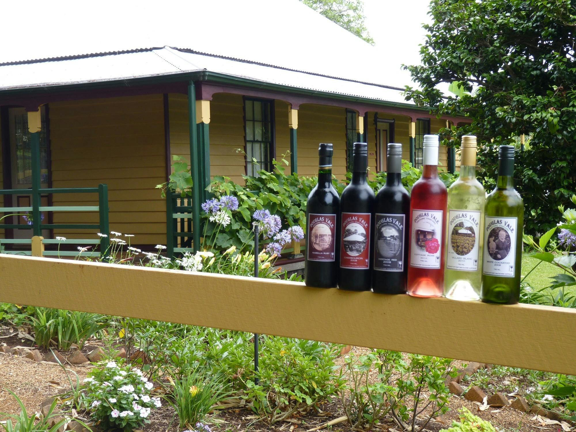 Historic Homestead with a range of Douglas Vale wines on the fence