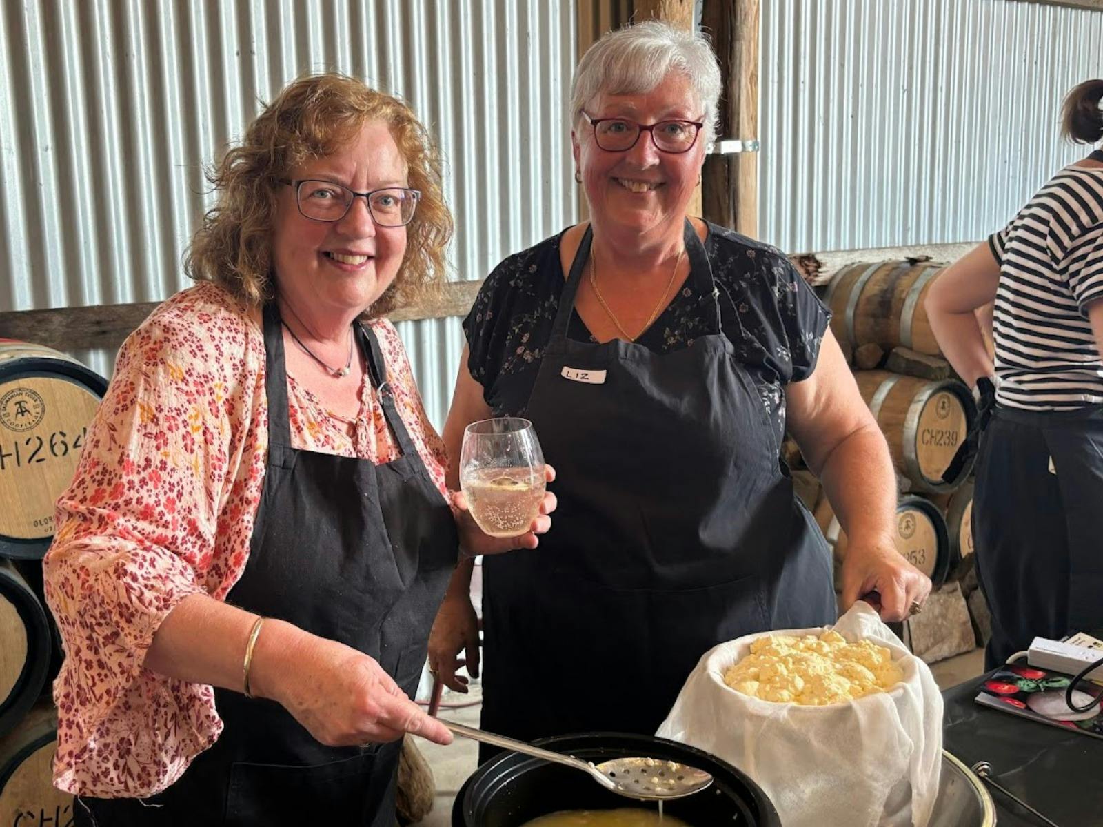 Smiling Ladies making cheese
