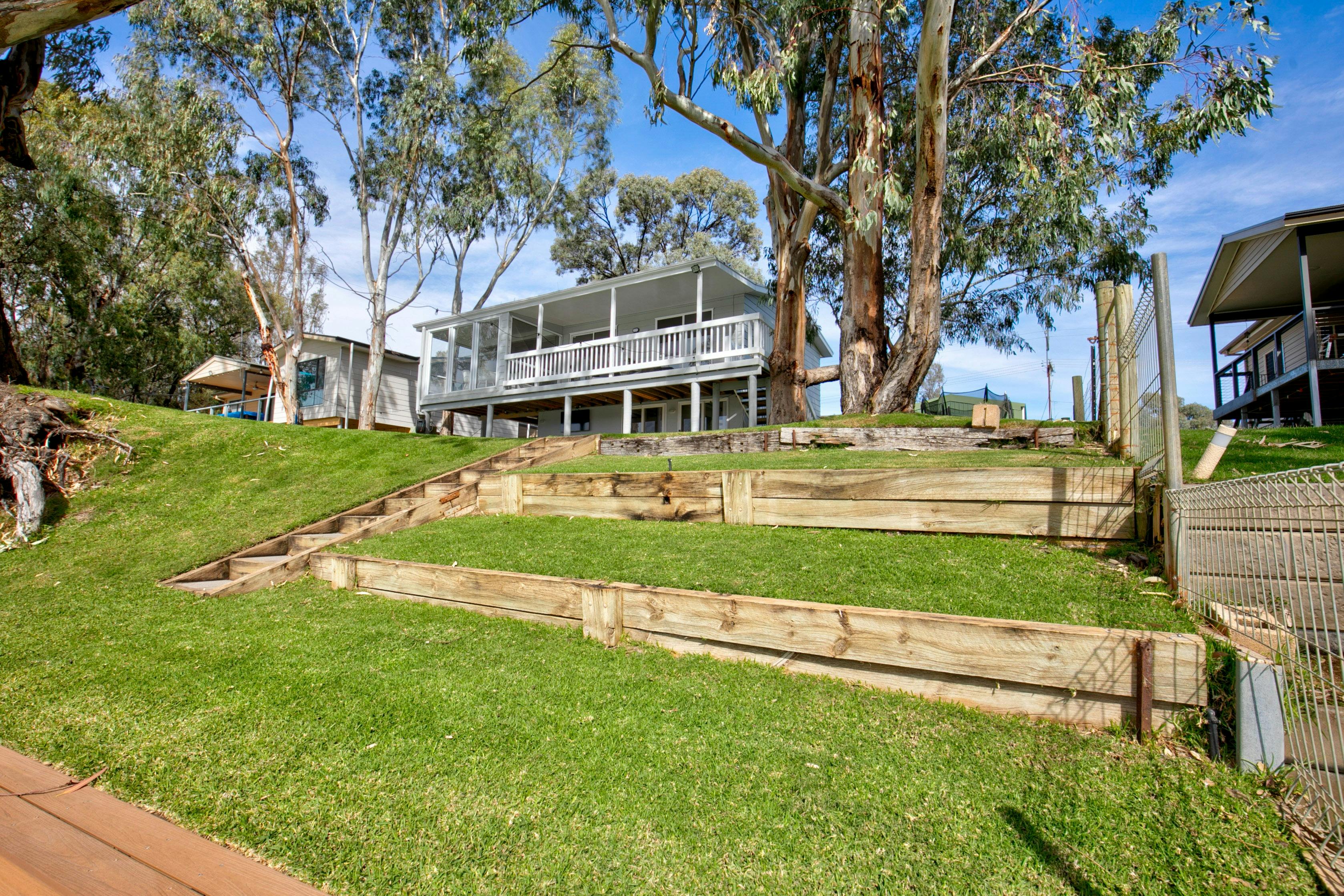 lawned down to the rivers edge