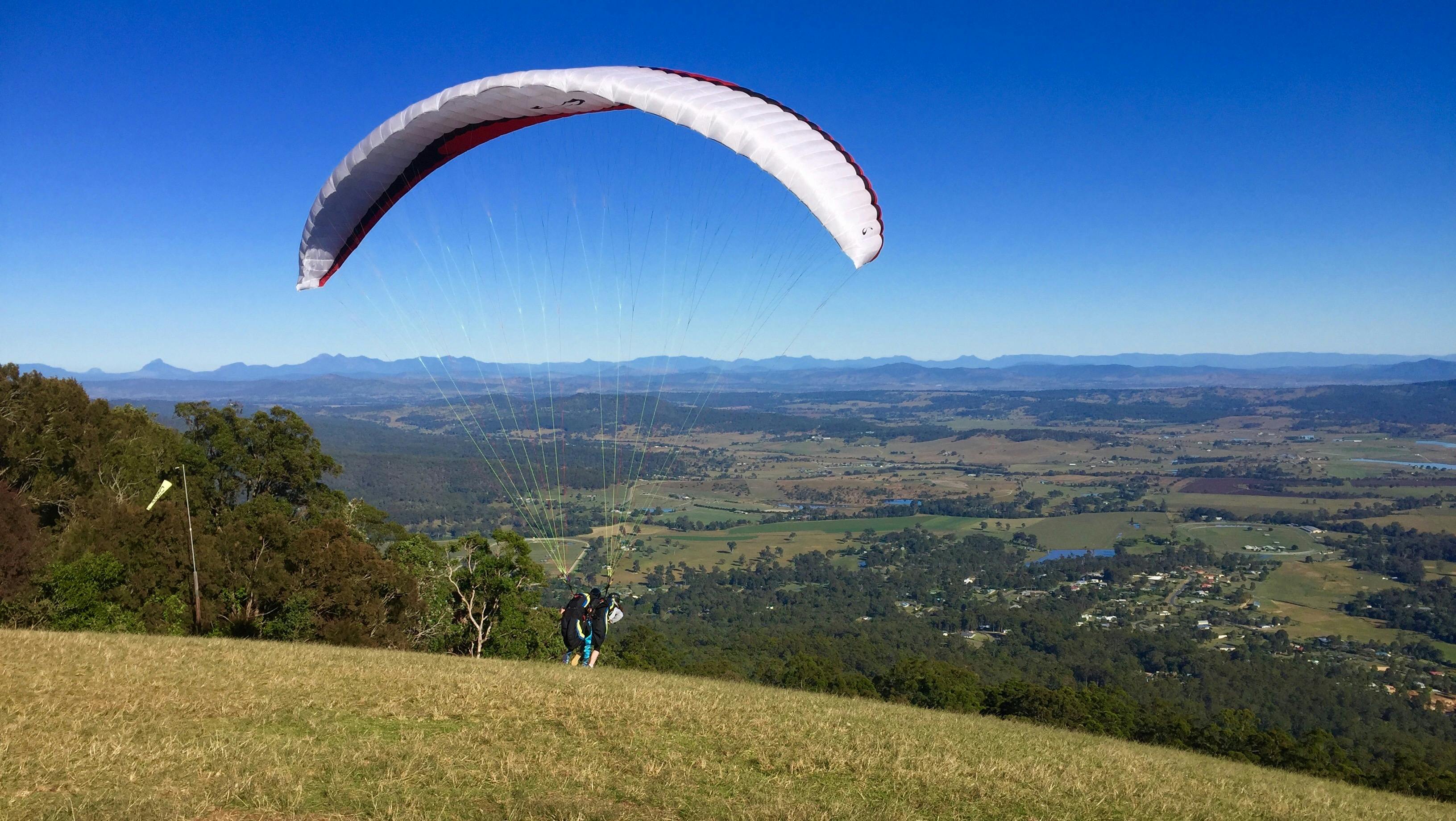 Tandem paragliding off Mt Tambourin  with instructor Lisa Bradley