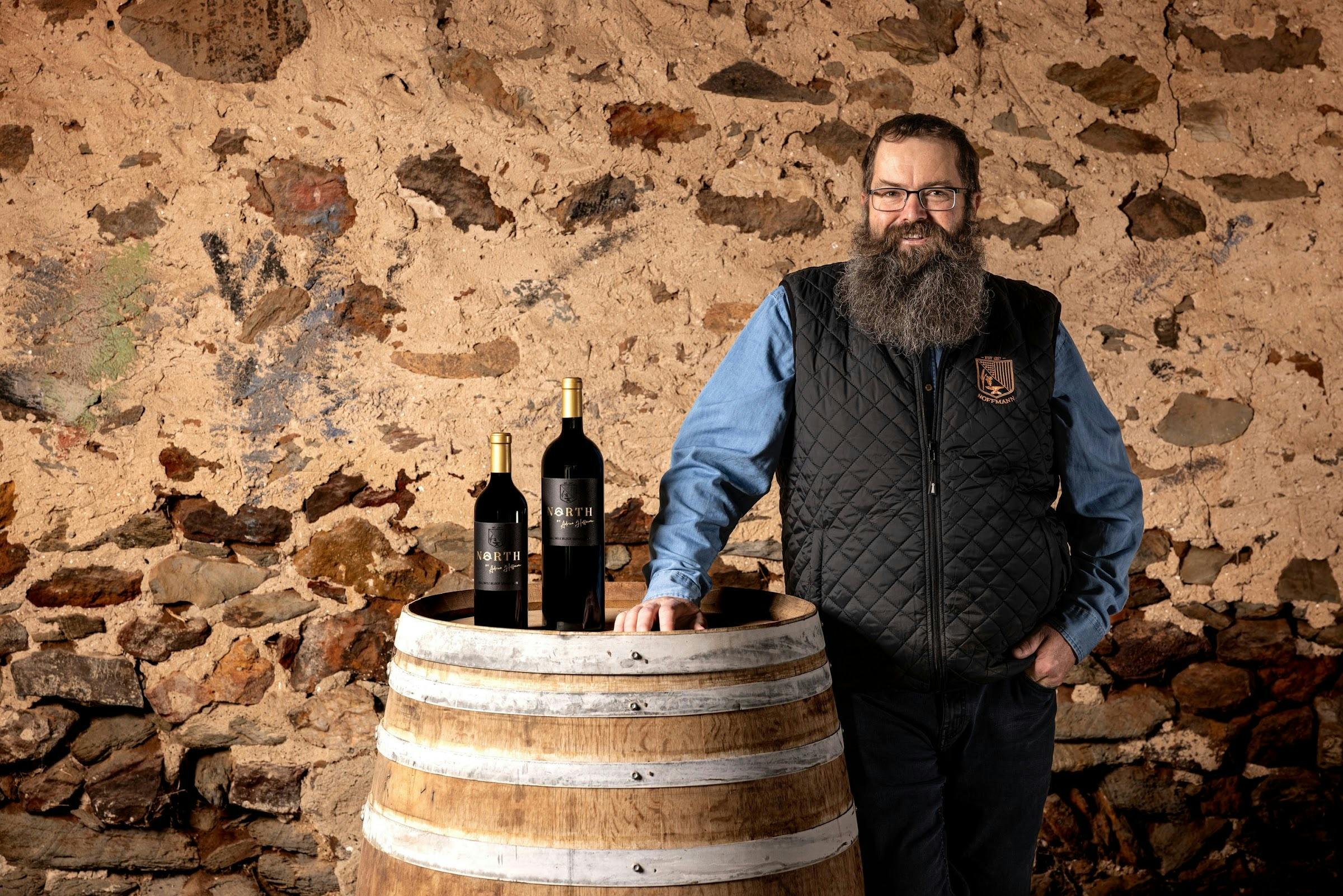 Adrian Hoffmann with a wine barrel in the family barn at Ebenezer, Barossa