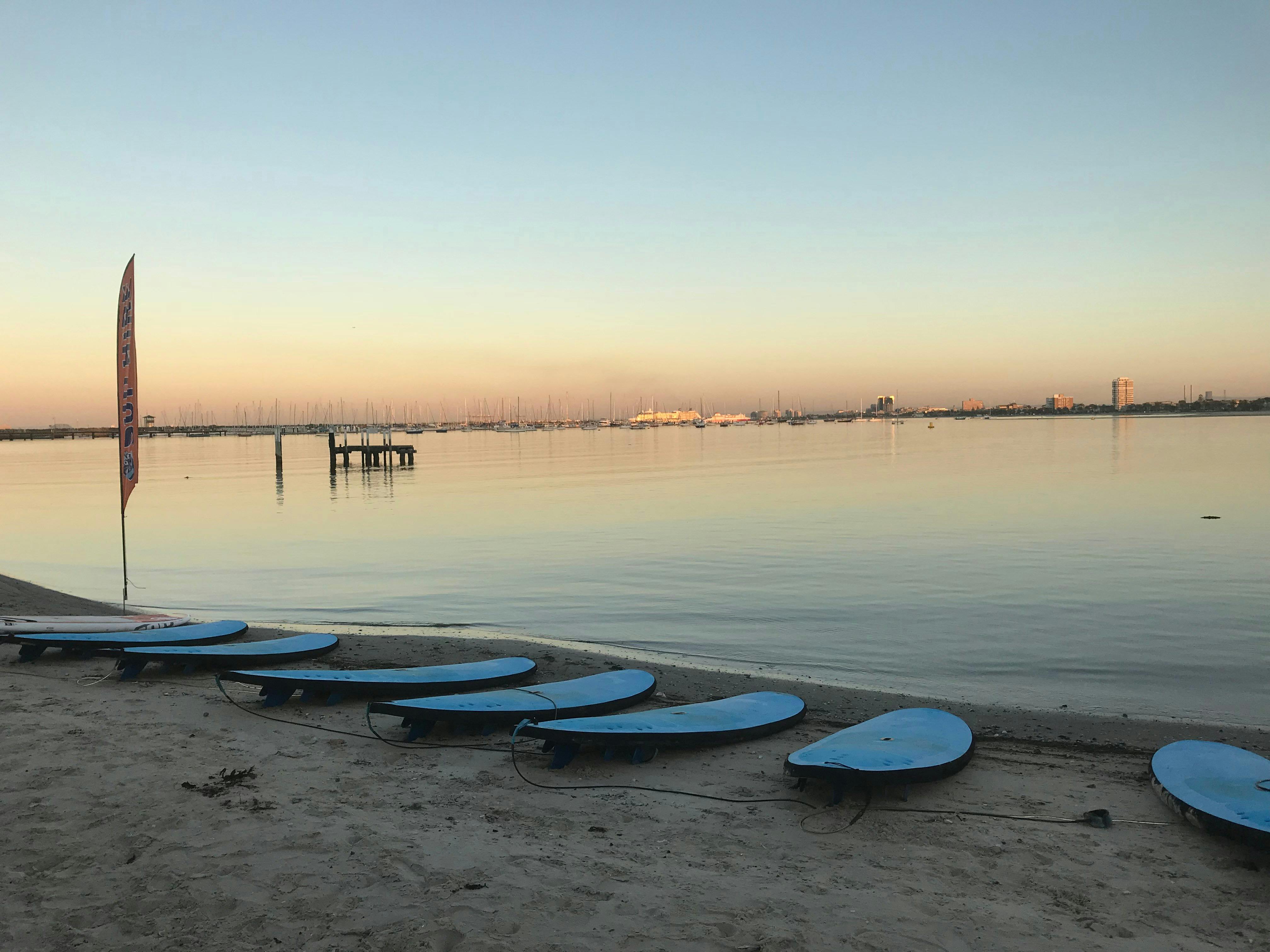 Stand up Paddle board ready on the shoreline of the beach