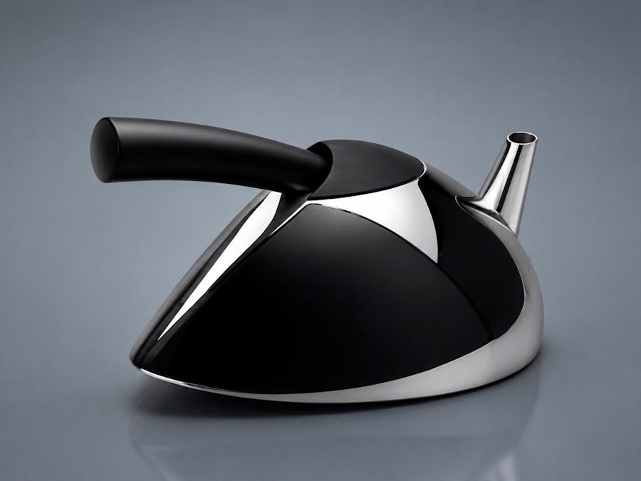 silver and black teapot with a long straight black handle