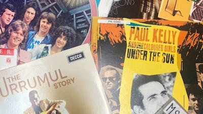 a collage of vinyl album covers