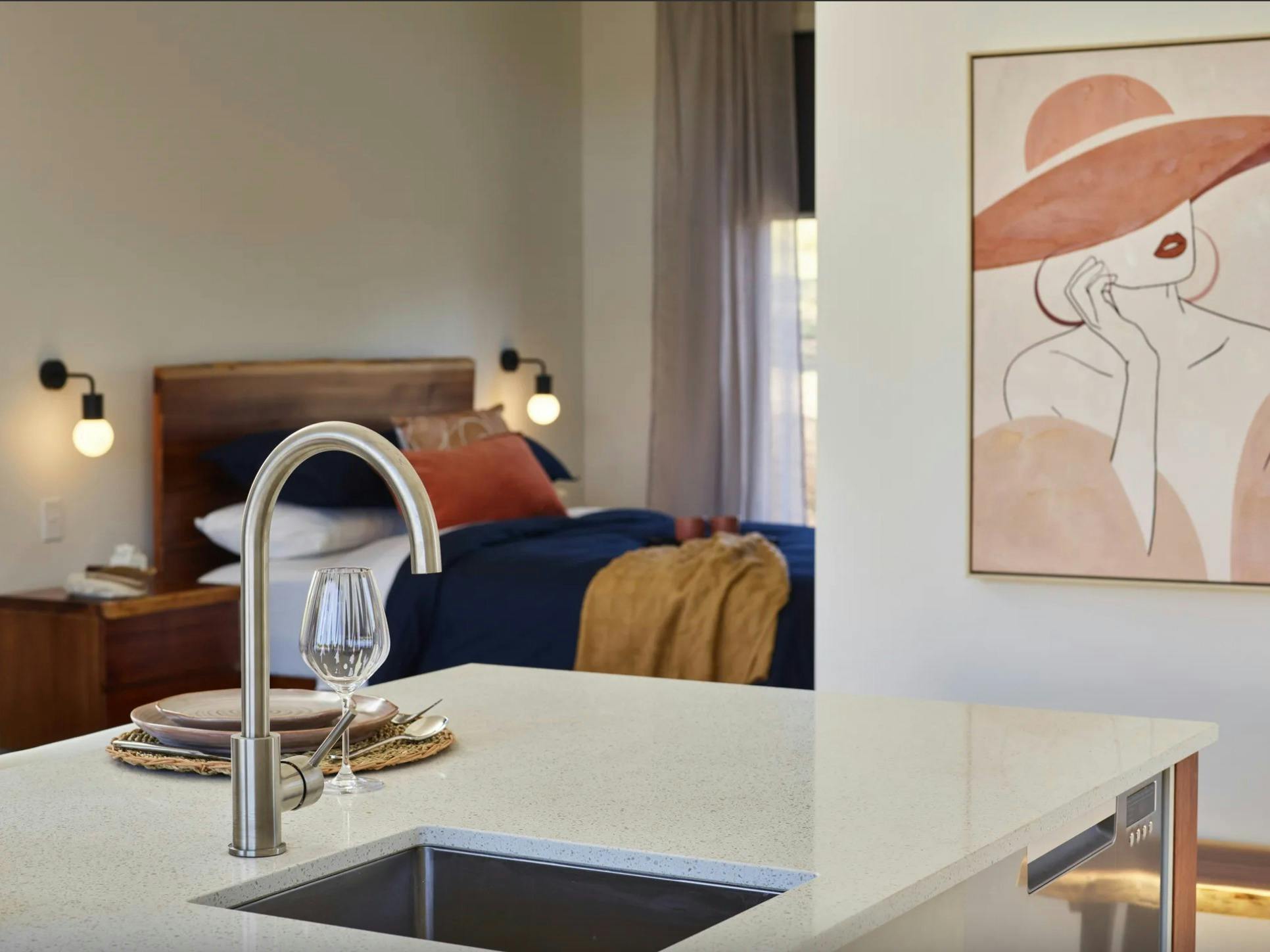 Kitchen sink and bedroom in the background