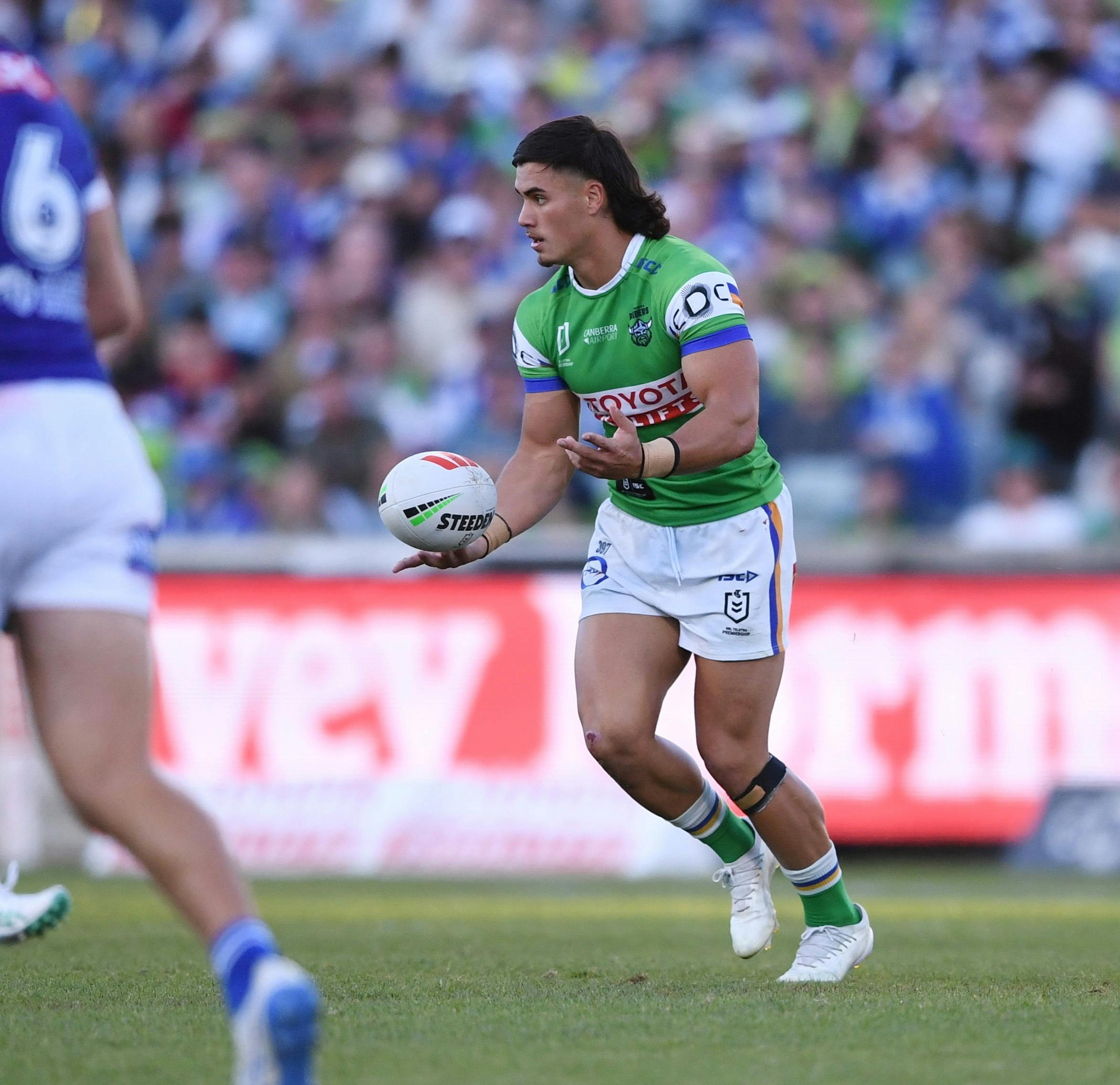 Canberra Raiders player Kaeo Weekes passing the ball.