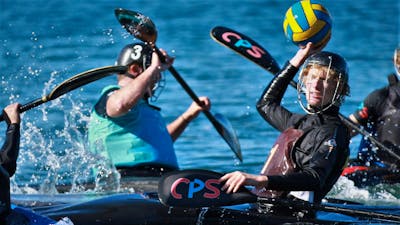 A player hold the ball up to pass