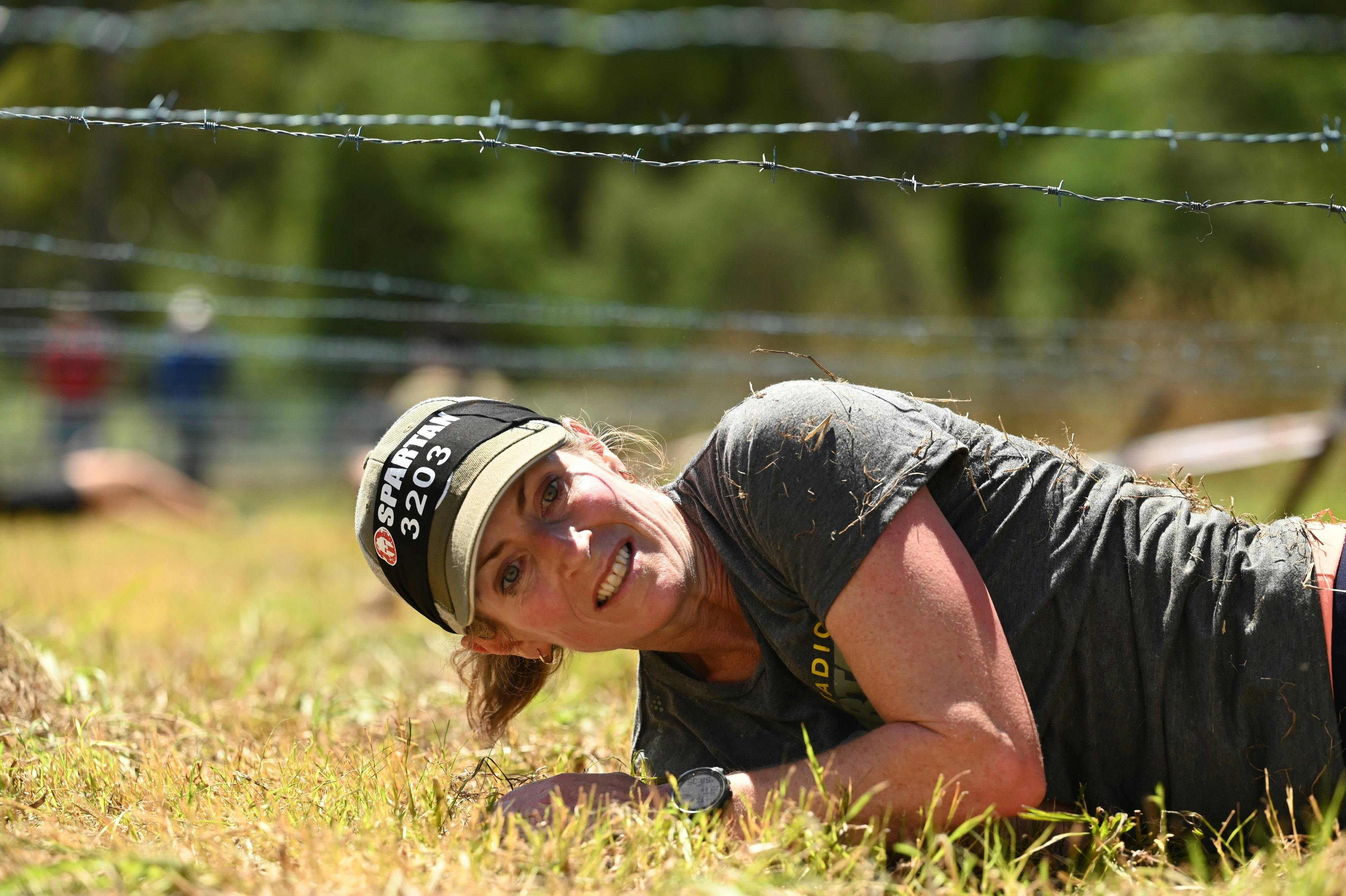 A person competes in Spartan Race.