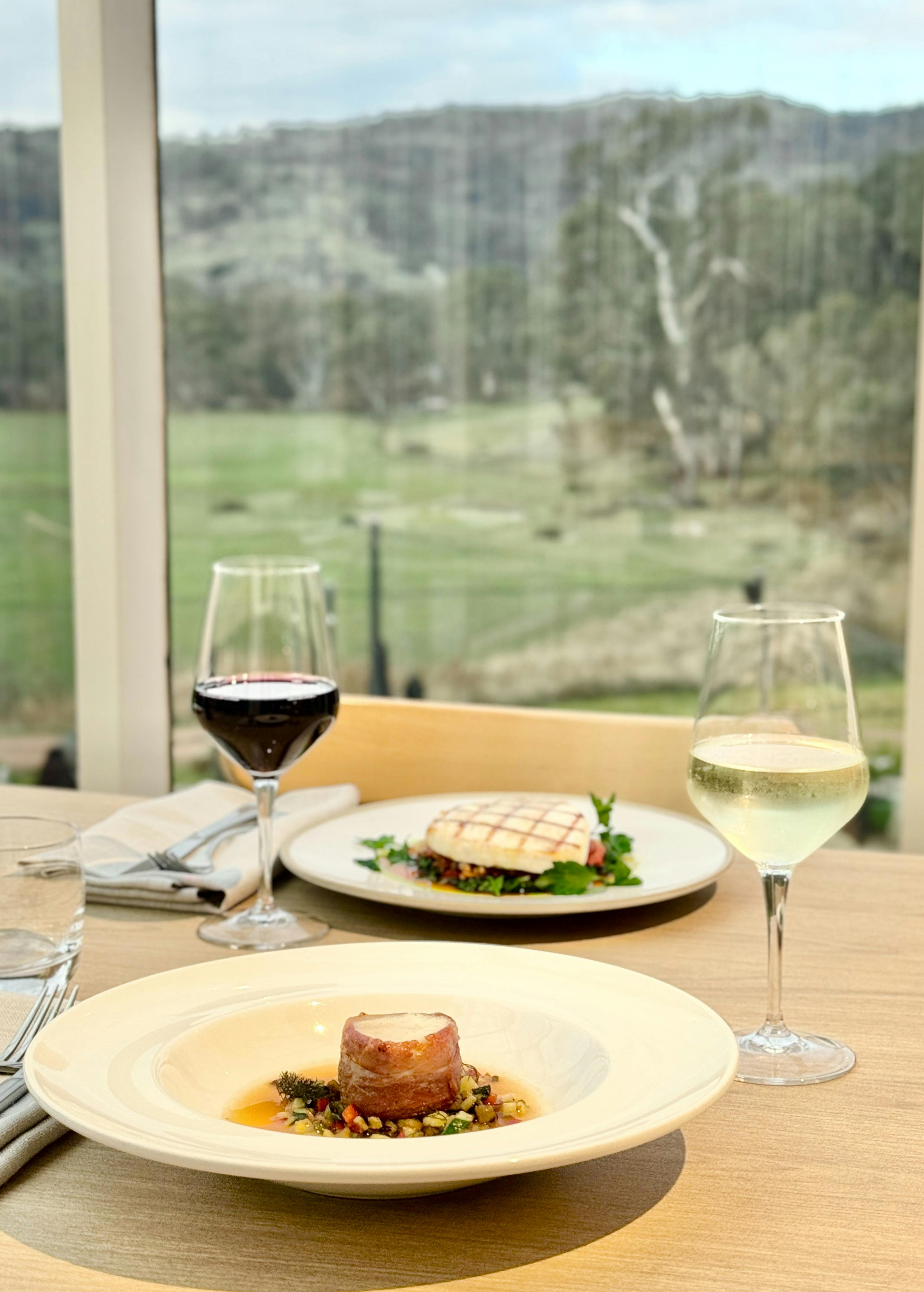 2 dishes on the table with view at The Trawool Estate