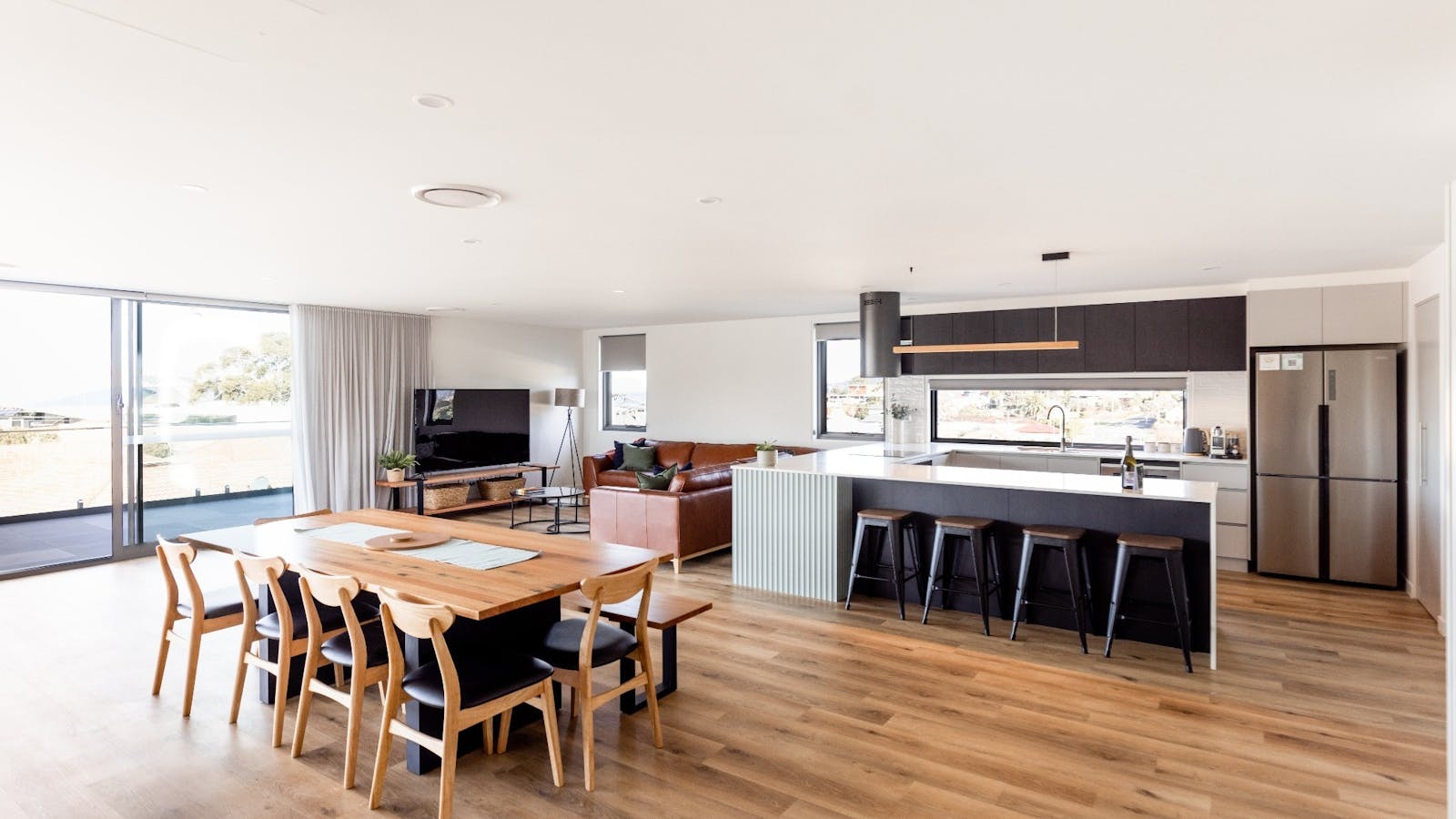 Open plan living, dining and kitchen areas