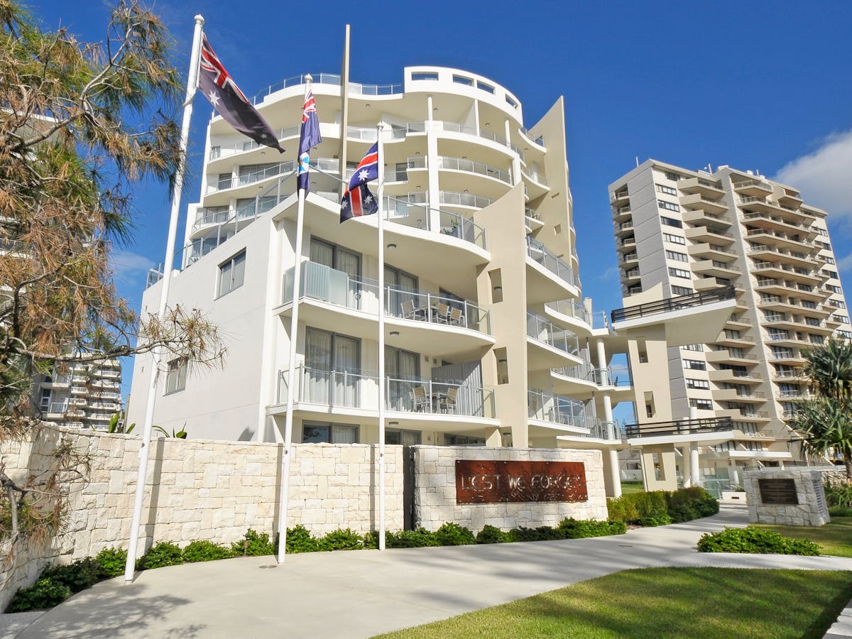 10-story elegant building with sandstone features, clear blue sky, and stunning ocean views 10-story elegant building with sandstone features, clear blue sky, and stunning ocean views