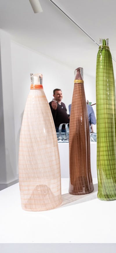 People walking around in a gallery.