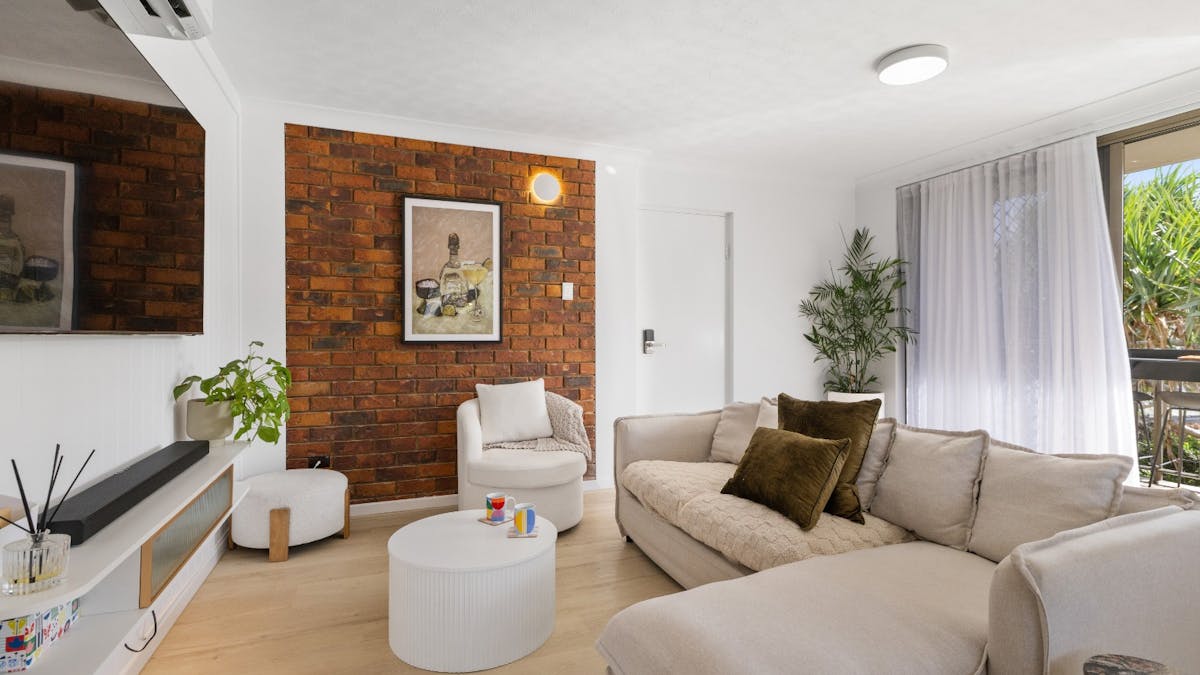 Open-plan living area with balcony access, Air-conditioning and Smart TV
