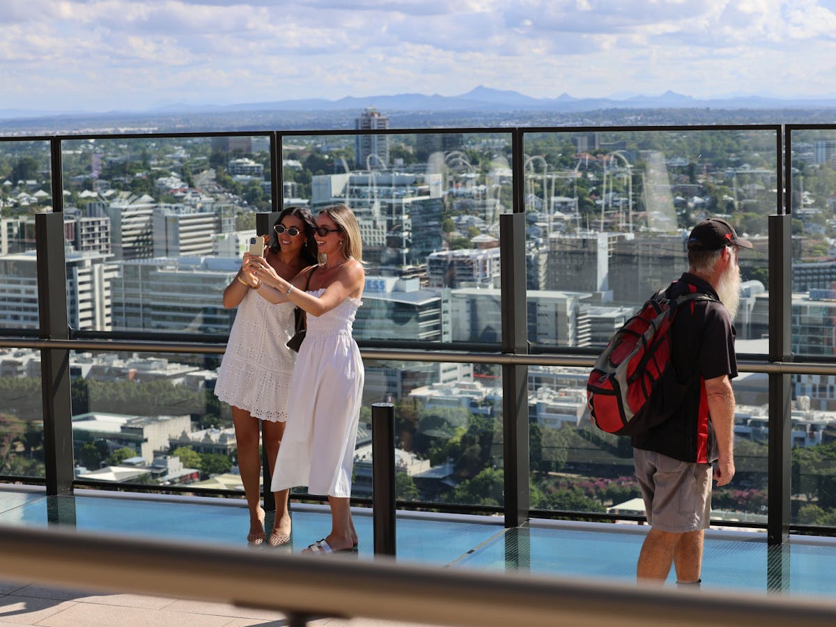 People taking selfies with the view on Sky Deck