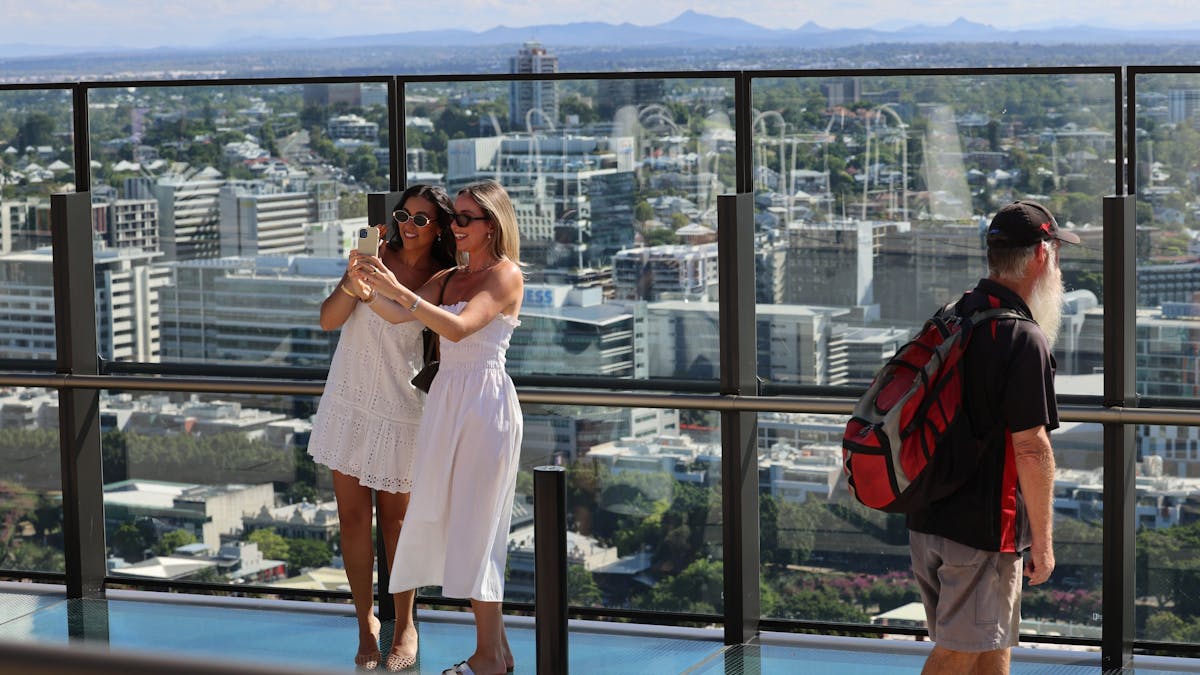 People taking selfies with the view on Sky Deck