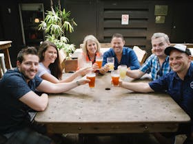 Tour participants with a cold beer