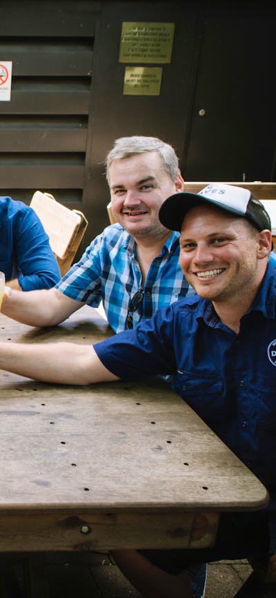 Tour participants with a cold beer