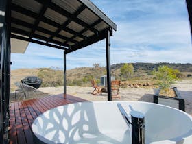 Rose Quartz Deck and outdoor bathtub with outdoor table and chairs and BBQ