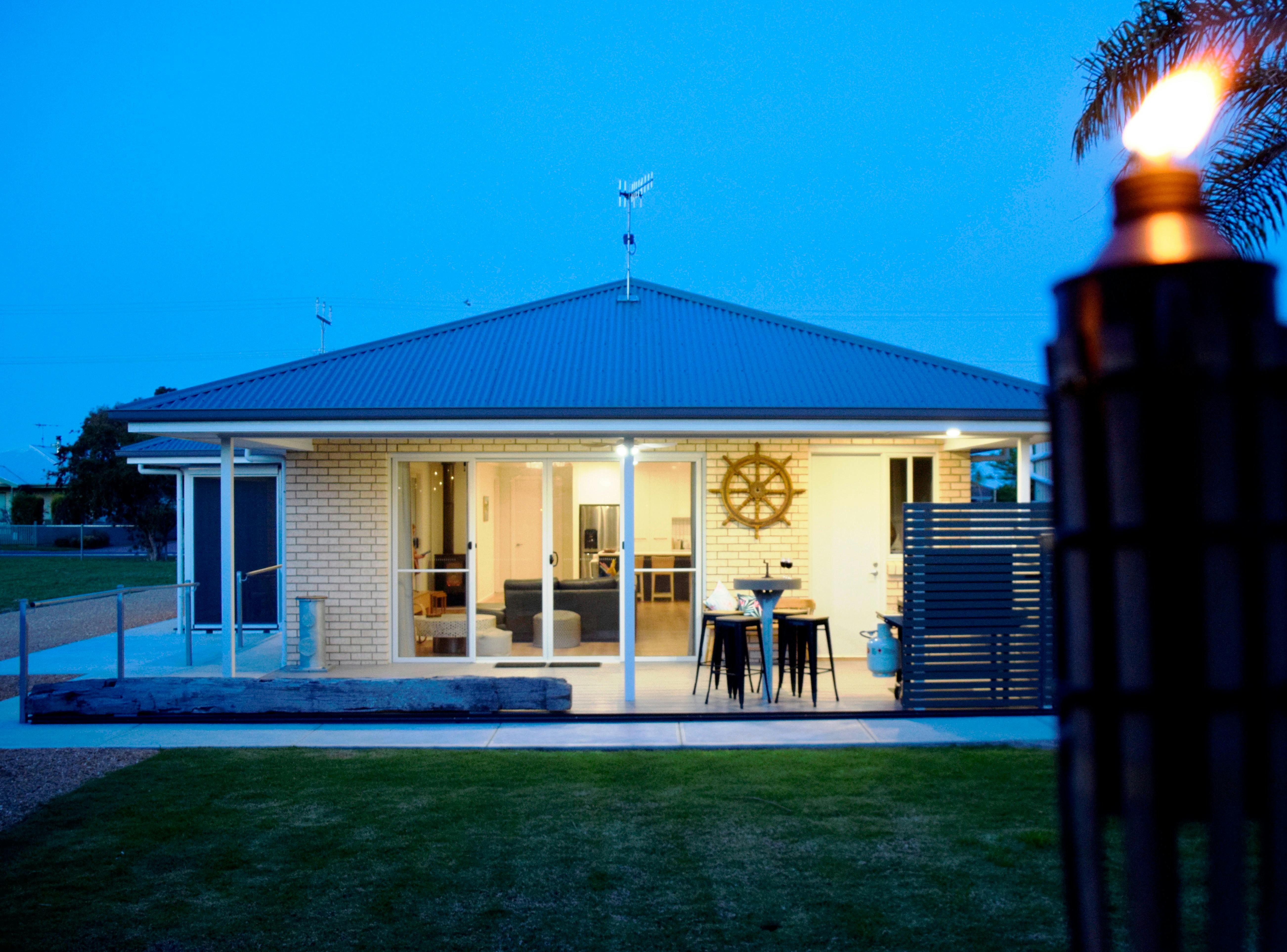 Rear deck for entertaining including BBQ,  under bench drinks fridge and outside  accessible sink