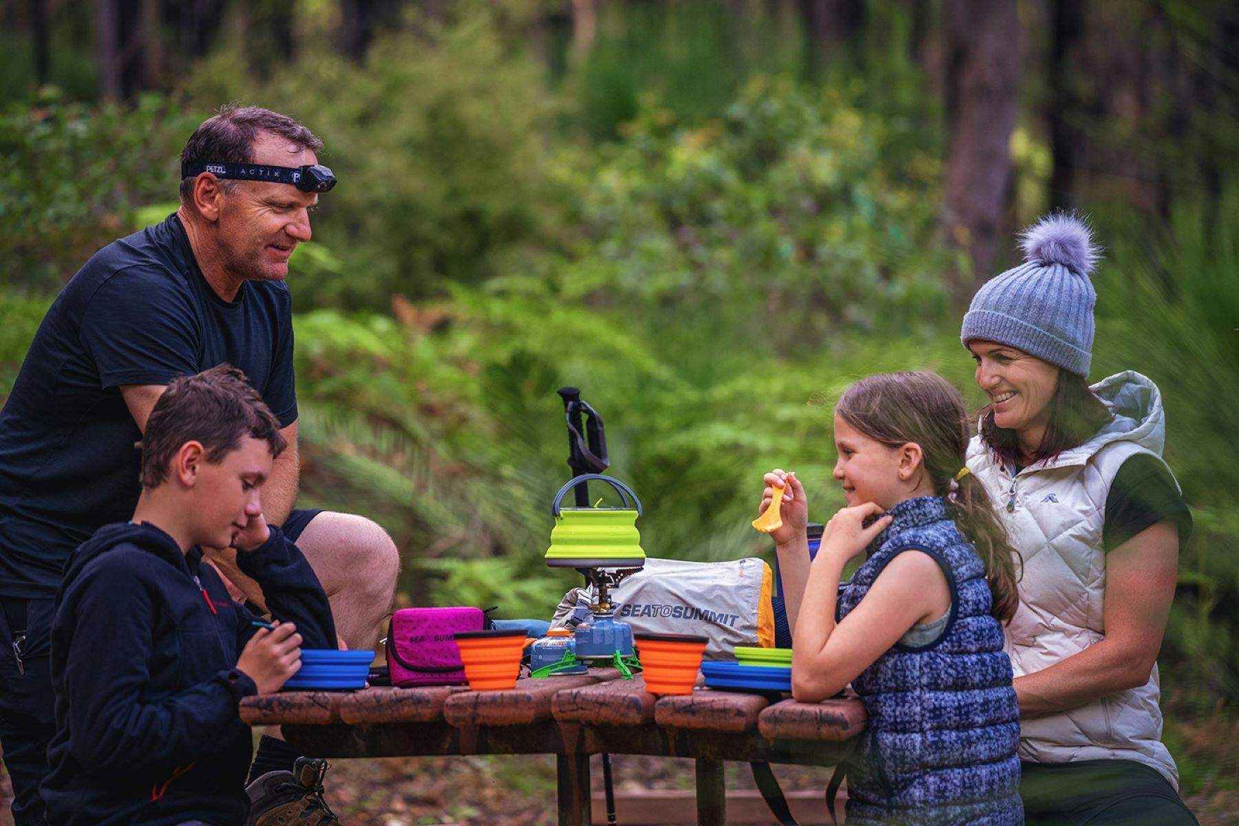 Hikers enjoying a meal at Swamp Oak Hut