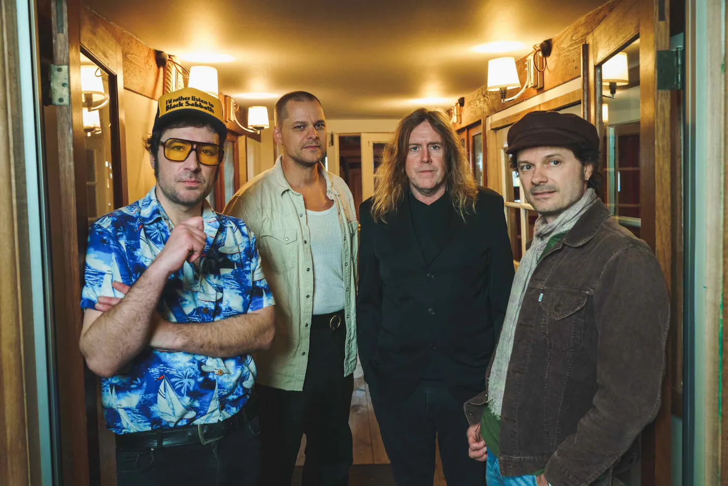 Photo of the four band members from left to right: Davey Lane, Mark Wilson, Kram, Darren Middleton.