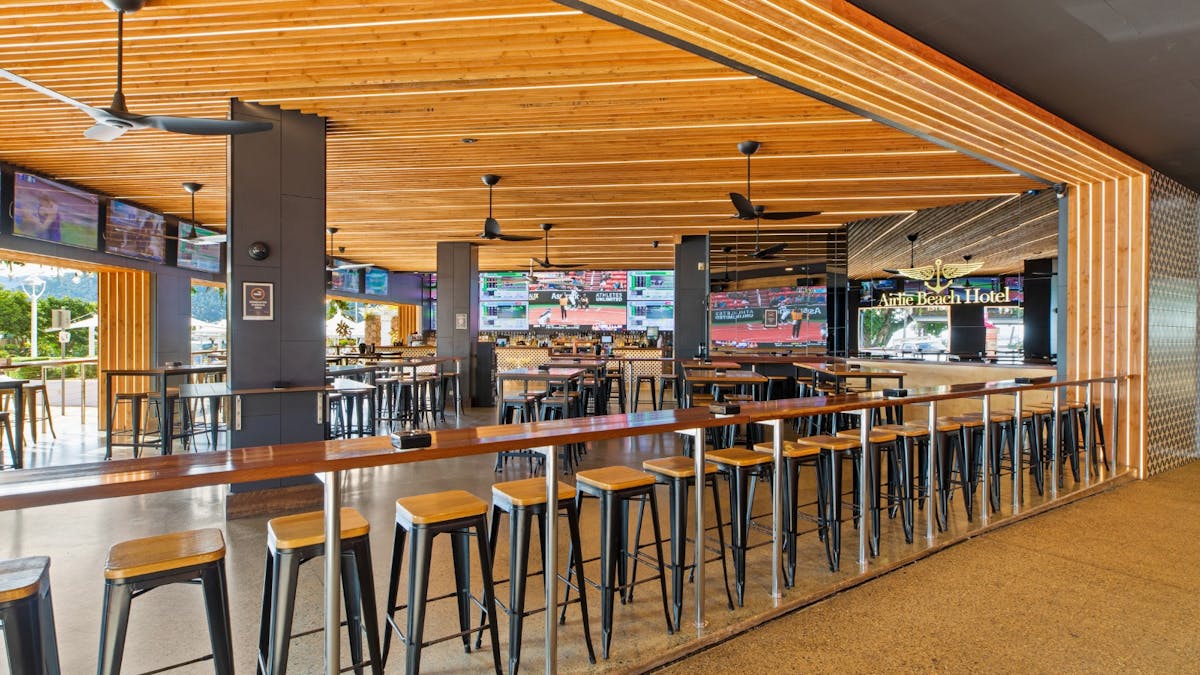 Sports bar at The Pub, Airlie Beach Hotel, with large screens, stadium sound