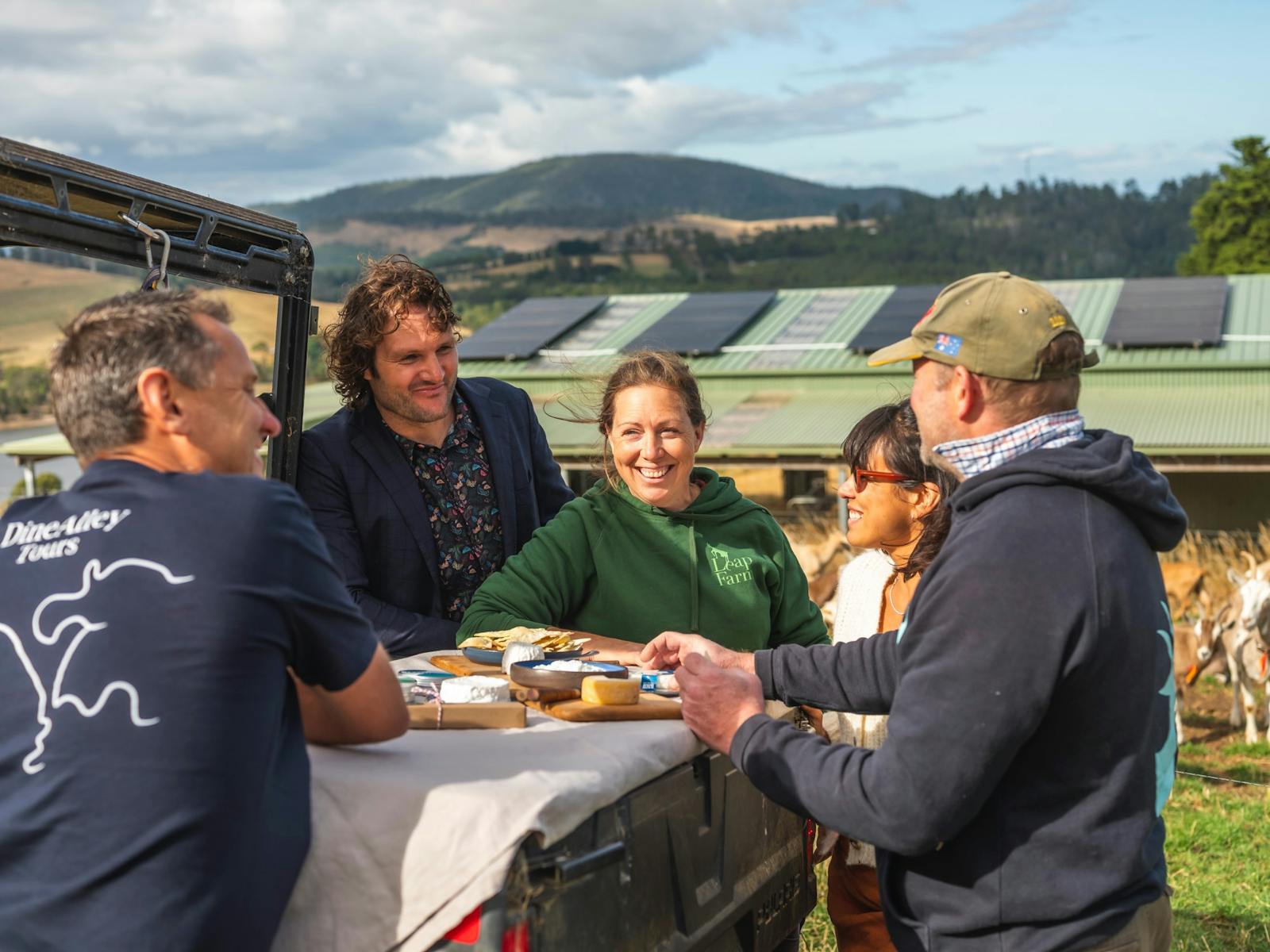 goat cheeses charcutier spread hand creams guests on farm tour working farm