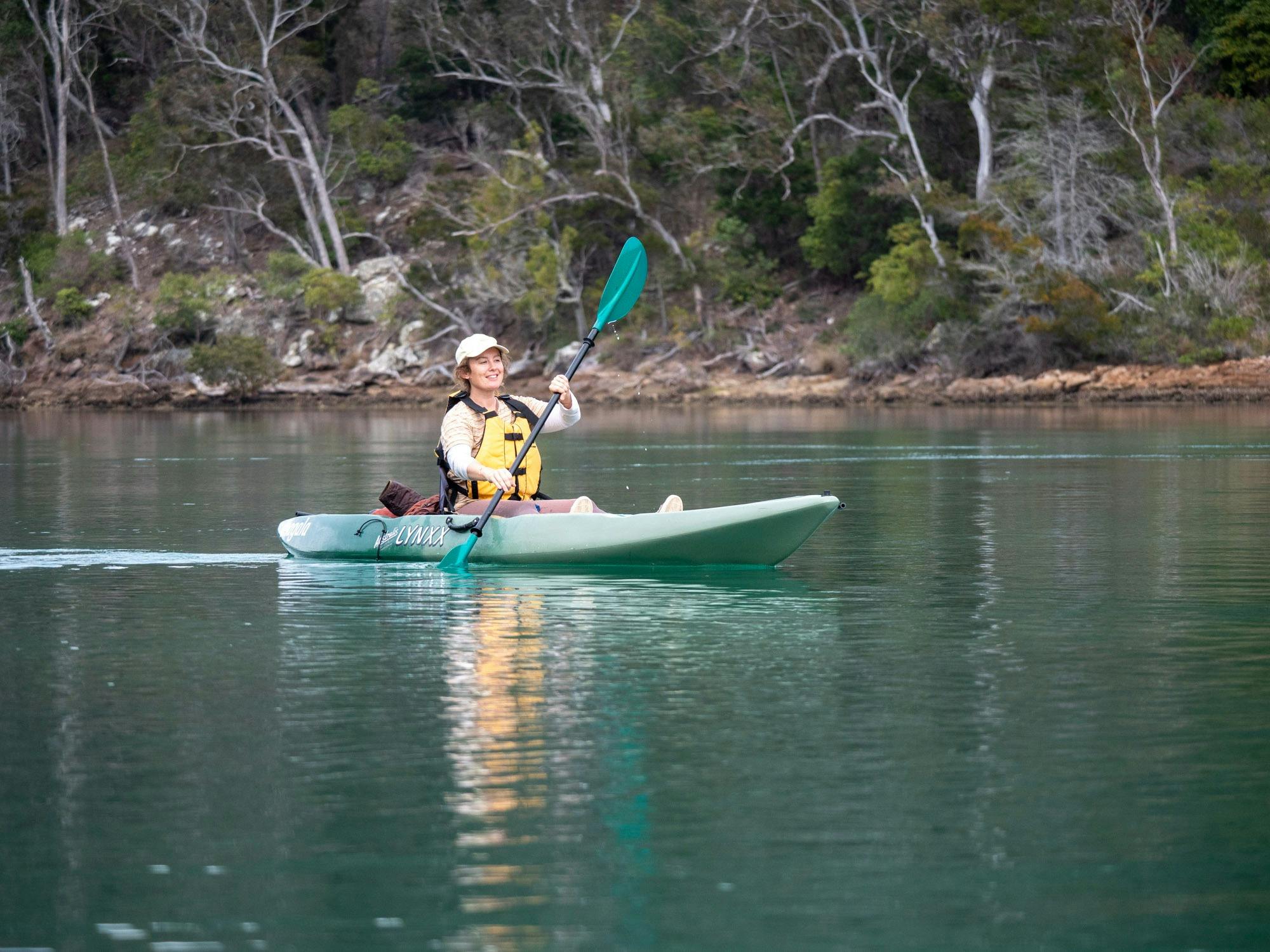 Guest paddling the Green waters of the Pambula River