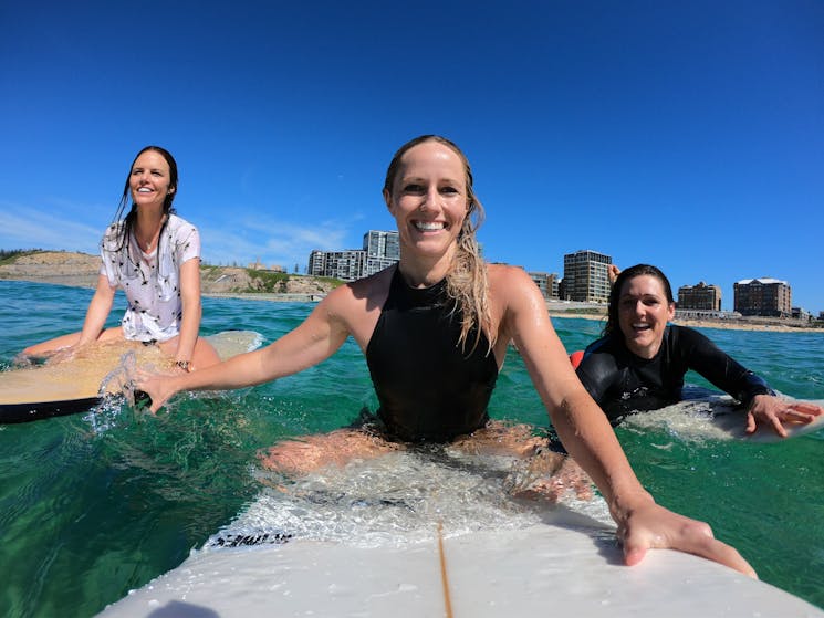Women surfing lesson