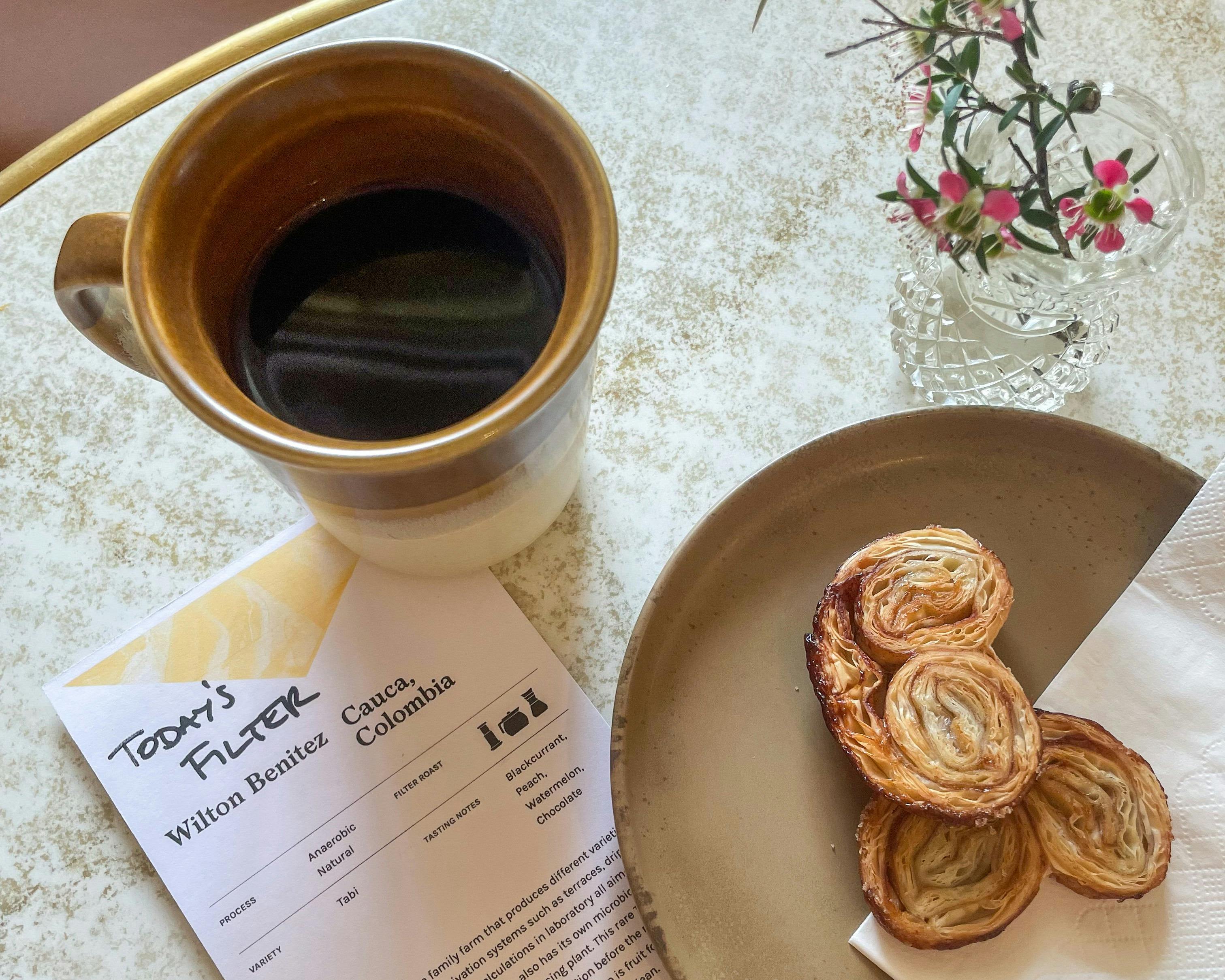 Close up of coffee and pastry