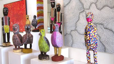 Large carved birds and ceremonial figures by Utopia artists, Aboriginal art paintings.