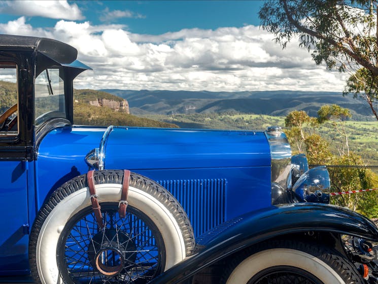 Vintage car overlooking valley view